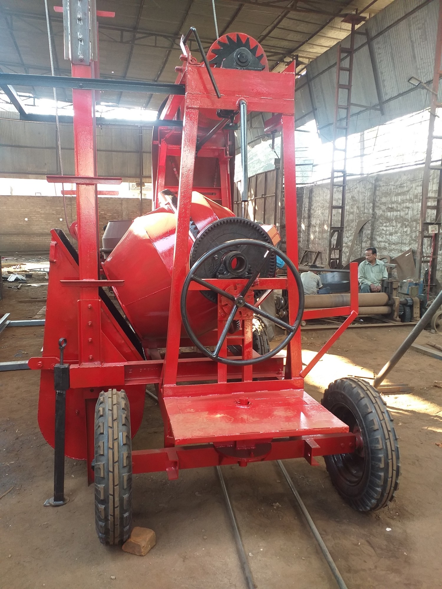 Concrete mixture machine with 2 pole tower lift