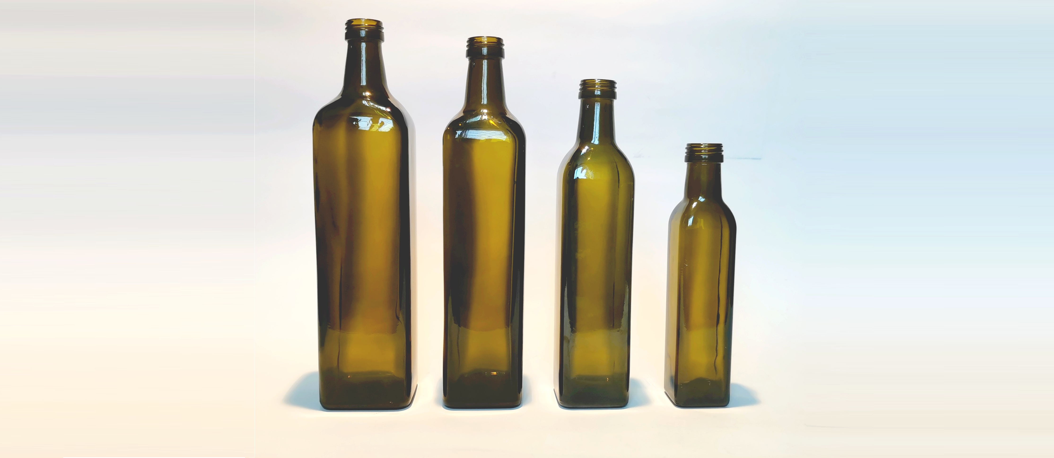 Bouteilles d'huile en verre de couleur olive